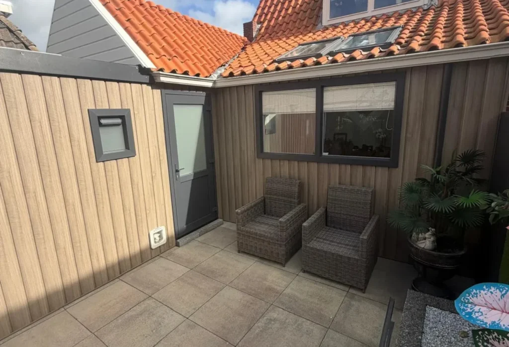 Finished courtyard with wood-look wall cladding