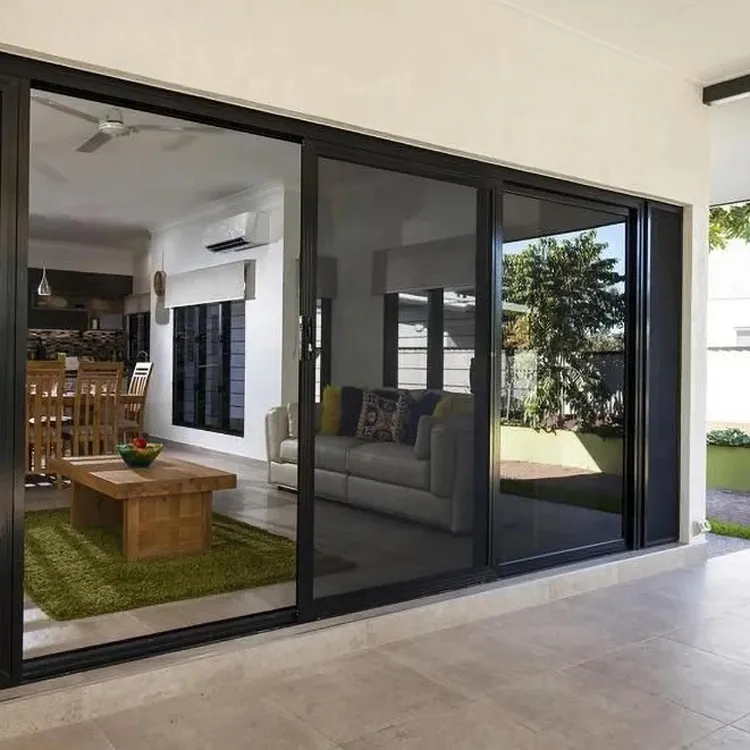 Black-framed sliding glass doors opening to a modern home interior.